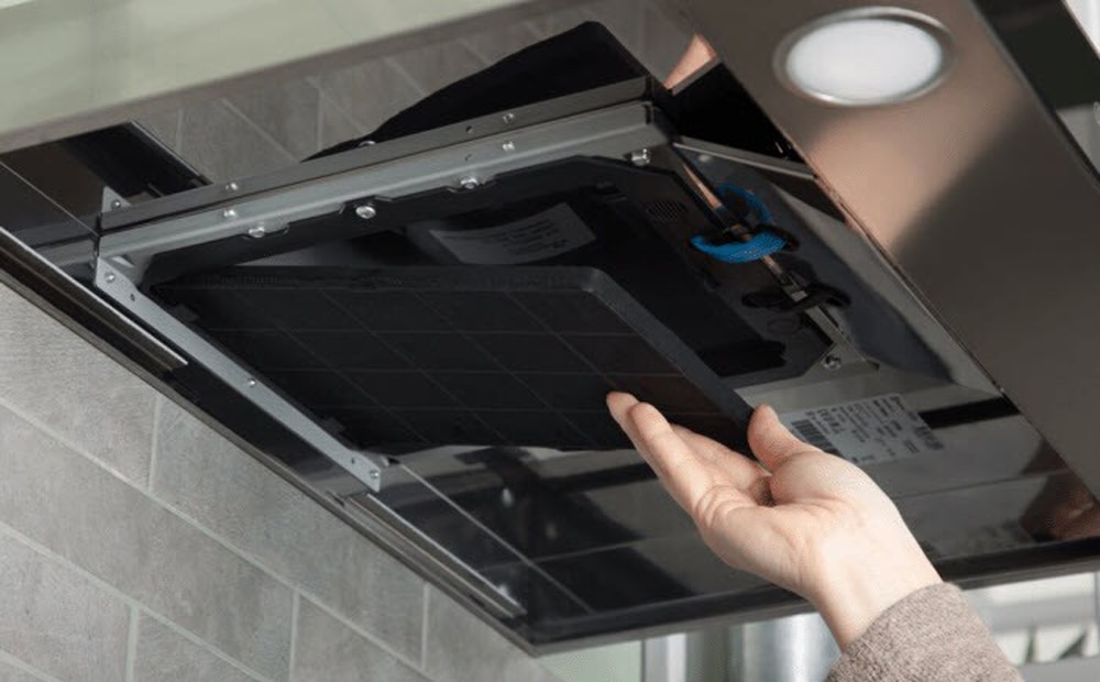 Remove and clean the cooker hood filter